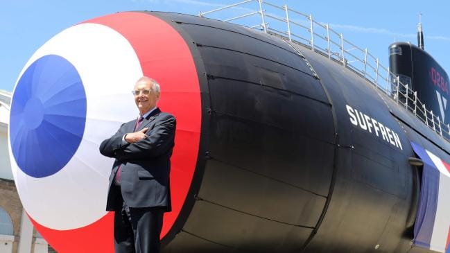 Naval Group CEO Herve Guillou poses in front of the new French nuclear submarine Suffren in July. Picture: AFP